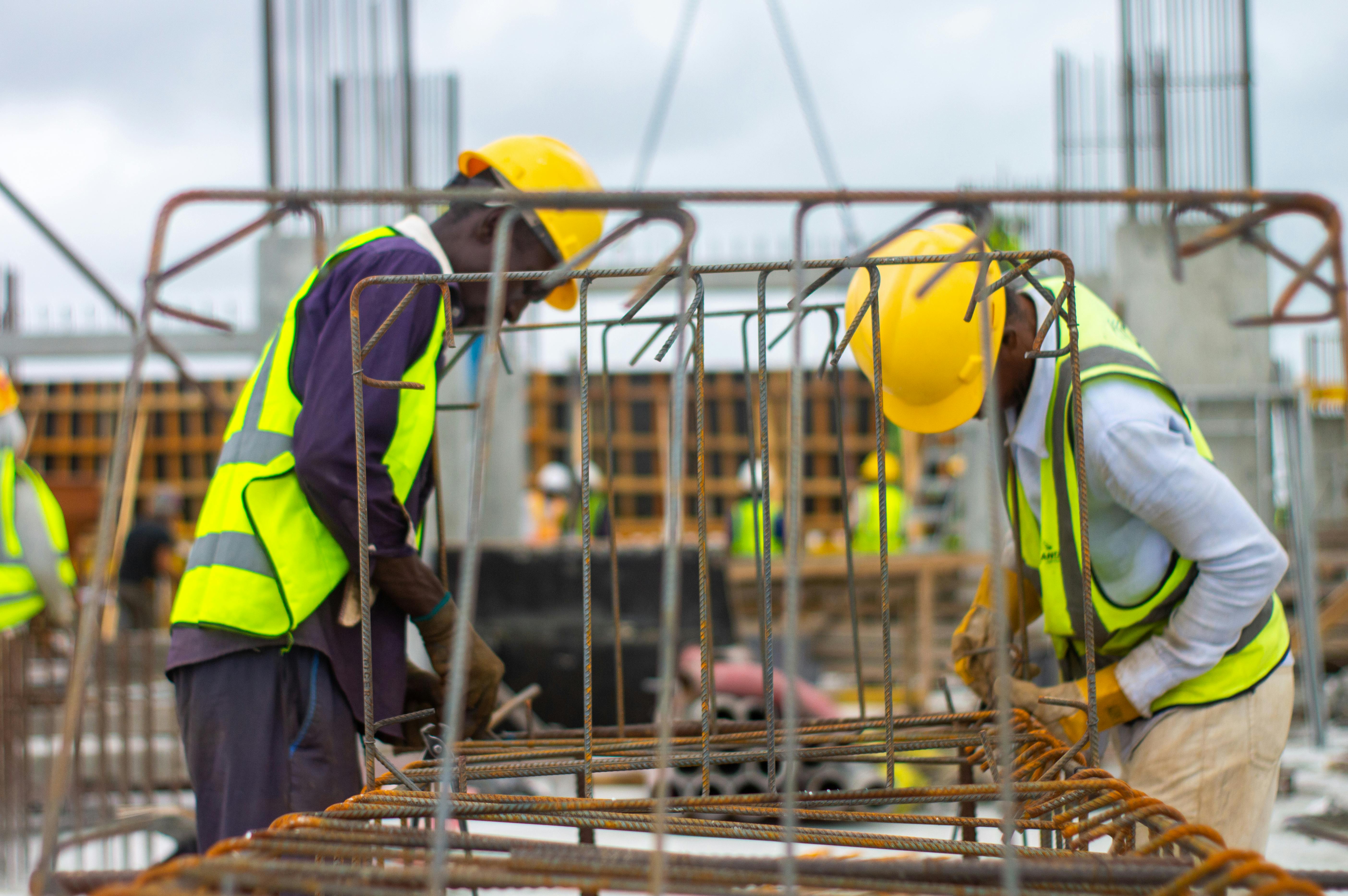 Verified construction team reviewing project plans on site
